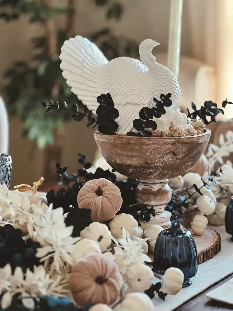 A side view of a white turkey Thanksgiving centerpiece with blue and white accents