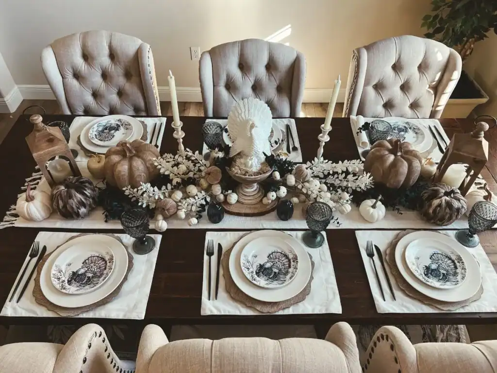 A tablescape decorated for Thanksgiving in blue and white decorations