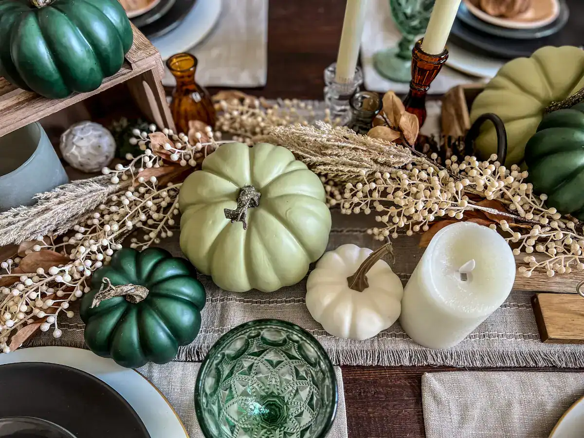 Two green pumpkins and one white one as decor for a thanksgiving tablescape