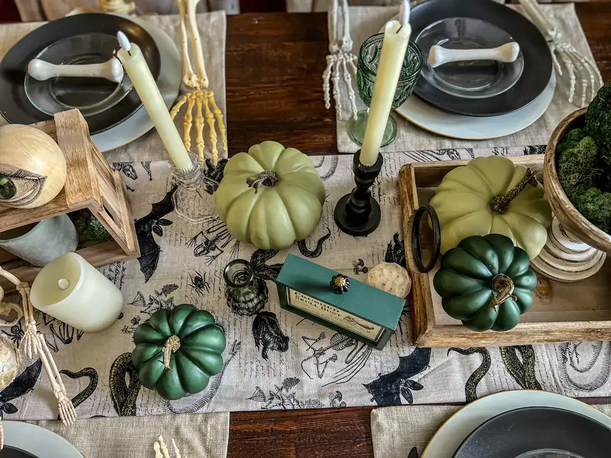 Green themed halloween tablescape with various green decor items displayed