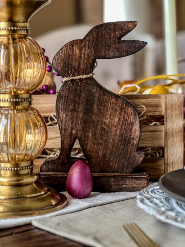 Wooden bunny figurine for Easter spring tablescape, perfect for festive table decor and seasonal celebrations.