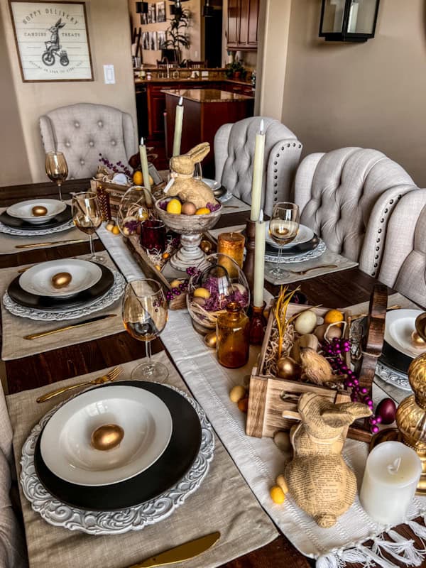 an easter dining room tablescape with purple, wood and yellow decor and accents throughout